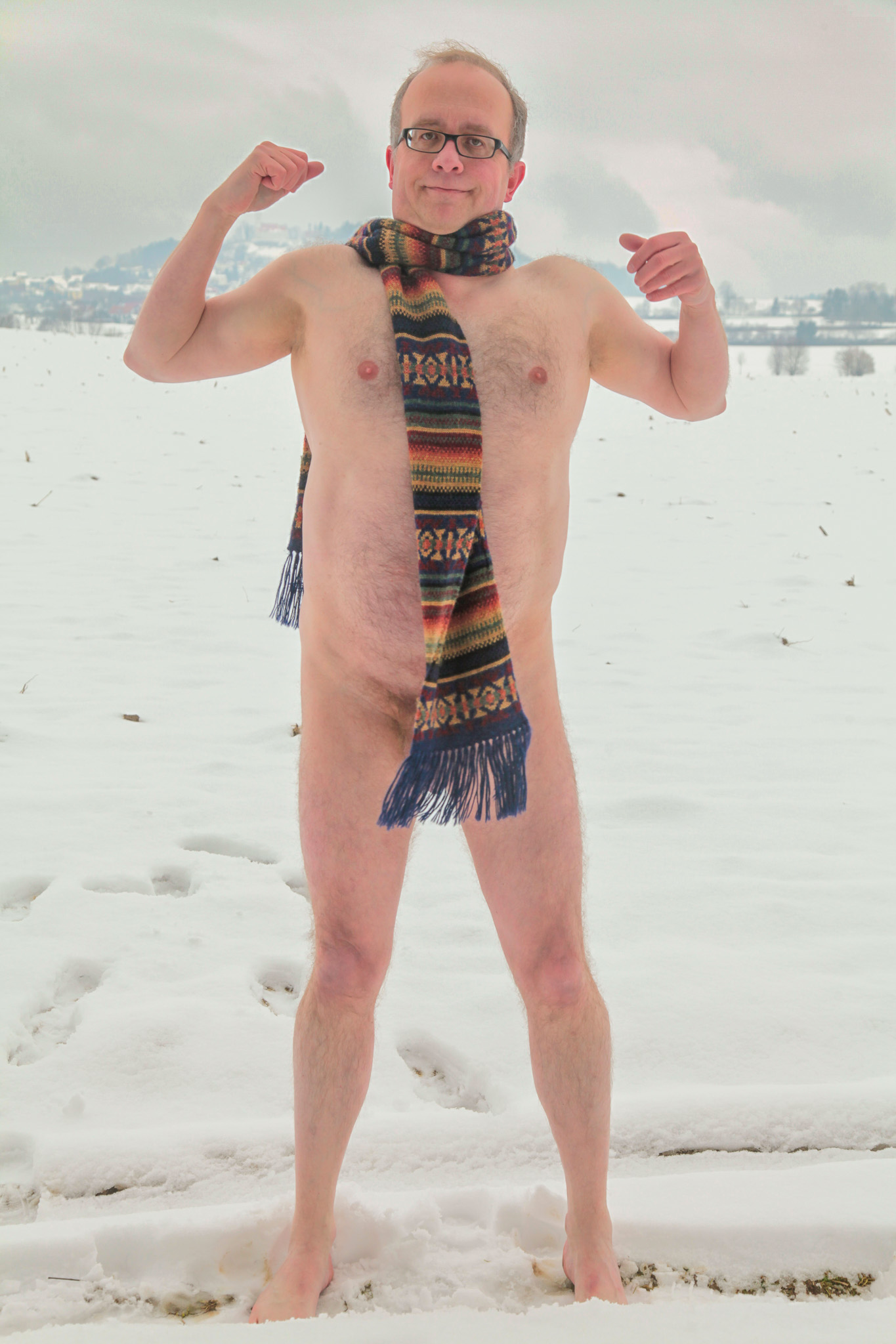 Male nude in Germany with scarf barefoot in the snow